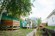 © AD Astra Team/Stocksy - Mom and daughter are picking cabbage in the garden