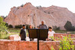 © Jennifer Bogle/Stocksy - Father and children pause to read sign in Colorado park