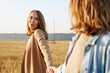 © AD Astra Team/Stocksy - lesbian couple in wheat field