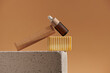 © Marc Tran/Stocksy - Eco friendly concept with skincare oil bottle, comb and organic soap