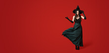 Beautiful Woman Dressed As Witch For Halloween On Red Background With Space For Text