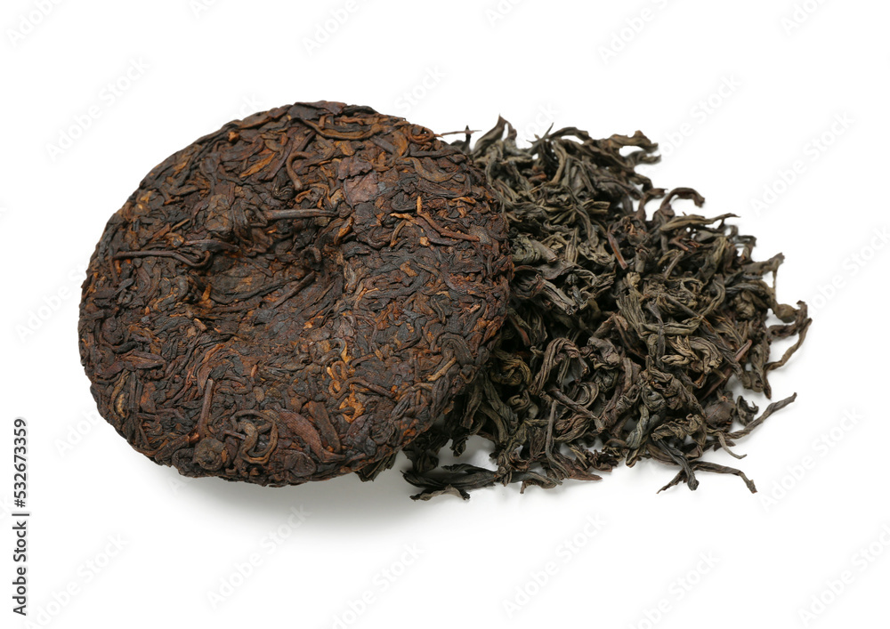 Dry pressed puer tea on white background
