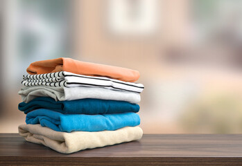 Wall Mural - Stack of folded clothing, autumn colors stacked sweaters.Heap of clothes.Laundry,household.