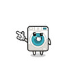 © heriyusuf - washing machine mascot pointing top left
