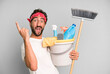 young crazy bearded and expressive man with clean products. housekeeper concept