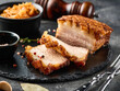 Roasted pork belly. Crispy Roast Pork Belly with stewed cabbage and spices. CLose-up