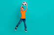 © deagreez - Full length photo of cheerful funny funky boy football fan champion rejoice enjoy hobby empty space isolated on cyan color background