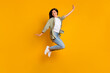 © deagreez - Full body portrait of cheerful gorgeous lady have fun good mood jumping isolated on yellow color background