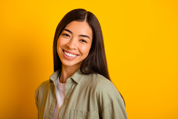 Wall Mural - Photo of cheerful adorable girl toothy beaming smile look camera good mood isolated on yellow color background