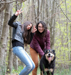 sisters in the forest with dog