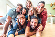 © Davide Angelini - Group of happy friends taking selfie at home - Business colleagues during break from work taking selfie picture in office relaxation area at startup office