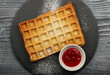 American or Belgian waffle with raspberry jam