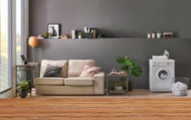 Wall Mural - Wooden table close up and decorative grey room background style, blur detail.