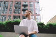 © BullRun - Man with laptop on street