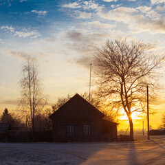 Wall Mural - beautiful winter frozen rural landscape at sunset