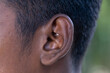 © batin - Human Ear - Close up of a man's ear Its body part helps to hear sound waves.