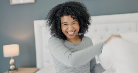 Canvas Print - Pov, couple and pillow fight on the bed in the comfortable bedroom at their home being playful. Happy young man and woman bonding and playing while having a friendly game in their house on weekend.