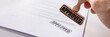 © Andrey Popov - Person's Hand Stamping Approved On Contract Paper