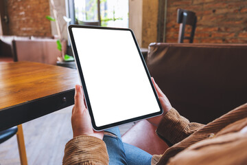 Wall Mural - mockup image of a woman holding digital tablet with blank white desktop screen