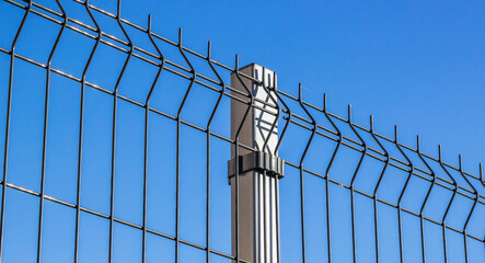 Wall Mural - Steel grating fence made with wire.
