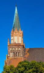 Wall Mural - Historic Holy Mary gothic Kosciol Mariacki church in old town quarter of Trzebiatow in Poland