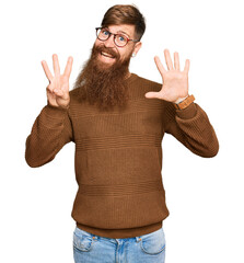 Canvas Print - Young irish redhead man wearing casual clothes and glasses showing and pointing up with fingers number eight while smiling confident and happy.