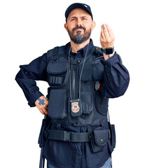 Wall Mural - Young handsome man wearing police uniform doing italian gesture with hand and fingers confident expression