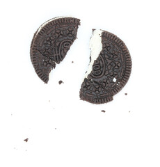 Sticker - Sandwich chocolate cookies with a sweet cream with crumbs isolated on white background