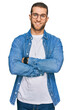 © Krakenimages.com - Young caucasian man wearing casual clothes happy face smiling with crossed arms looking at the camera. positive person.