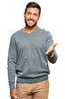 © Krakenimages.com - Handsome hispanic man wearing casual clothes smiling friendly offering handshake as greeting and welcoming. successful business.