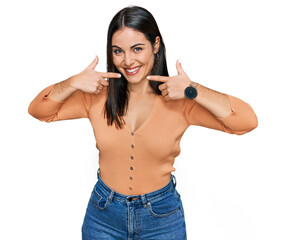 Sticker - Young hispanic woman wearing casual clothes smiling cheerful showing and pointing with fingers teeth and mouth. dental health concept.