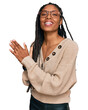 African american woman wearing casual clothes clapping and applauding happy and joyful, smiling proud hands together