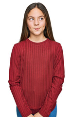 beautiful brunette little girl wearing casual sweater smiling looking to the side and staring away t