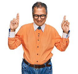 Sticker - Middle age indian man wearing casual clothes and glasses gesturing finger crossed smiling with hope and eyes closed. luck and superstitious concept.