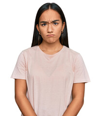 Poster - Young asian woman wearing casual clothes skeptic and nervous, frowning upset because of problem. negative person.