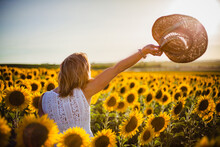 Beautiful Woman Saying Goodbye In The Field Of Sunflowers Near El Puerto De Santa Maria In Andalusia Spain