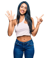 Wall Mural - young hispanic woman doing gesture 