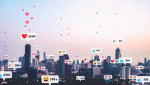 Social Media Icons Fly Over City Downtown Showing People Reciprocity Connection Through Social Network Application Platform . Concept For Online Community And Social Media Marketing Strategy .