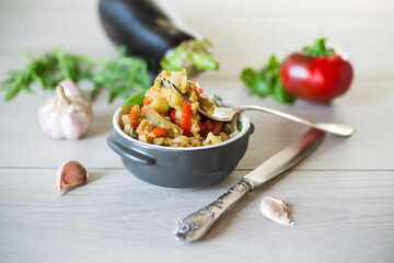 Wall Mural - eggplant fried sauteed with other vegetables in a plate