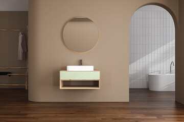 Beige minimalist bathroom interior with sun rays, cabinet, oval mirror, sink, white bathtub, parquet floor, tiles. Concept of minimal design. 3d rendering