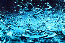 Blue Liquid Burst With Droplets, Water Splash Backdrop.  Abstract Perfect For Presentation, Business, Media, Banner, Backdrop Or Other Design Element. Render