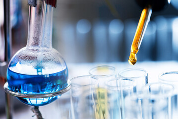 Test tube containing chemical liquid in laboratory, lab chemistry or science research and development concept.	