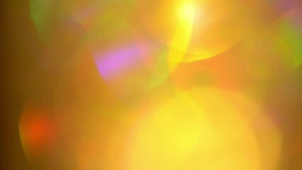 Wall Mural - Soft Color Bokeh with Light Leaks Movement. Abstract moving background. Large moving bokeh with bright sunbeams and light reflections randomly move. Multi-layer Lens flare effect.