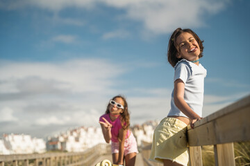 Wall Mural - Adorable child girls posing to the camera with funny faces and having fun