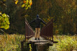 Young man in a black jacket standing on a narrow bridge. Pavel Kubarkov, i on narrow bridge and autumn nature around me. Photo was taken 20 September 2022 year, MSK time in Russia.