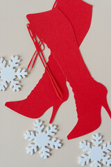 Sticker - white foam snowflakes and glyph or dingbat cutout of tall lace up stiletto boots