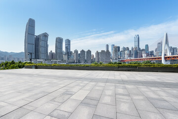 Poster - empty square floor with modern city background