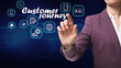 © New Africa - Customer journey concept. Woman pointing at virtual screen with different icons on dark background, closeup