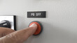 The on push button off and the worker's hand will press it. button to turn off by pressing manually.