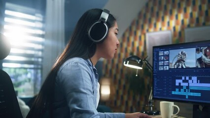 Poster - Asian woman in headset editing video with astronauts for client in program on personal computer while working at the table from home office. Freelance